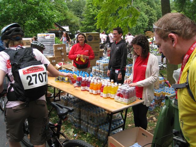 Hard Working Volunteers Handing Out Drinks