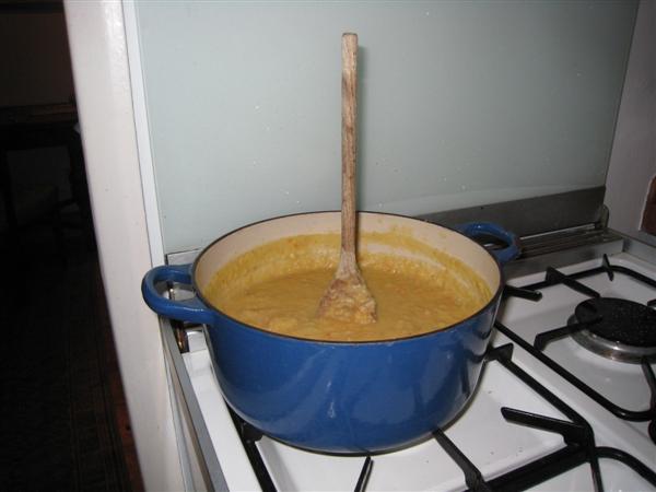 lentil soup with spoon standing up in it